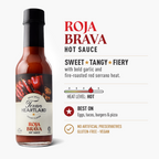 Texan Heartland Roja Brava Hot Sauce: sweet, tangy and fiery, with bold garlic and fire-roasted red serrano heat. Hot heat level; best on eggs, tacos, burgers and pizza. No artificial preservatives, gluten-free and vegan.